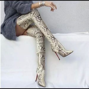 Woman’s snakeskin over the knee boots